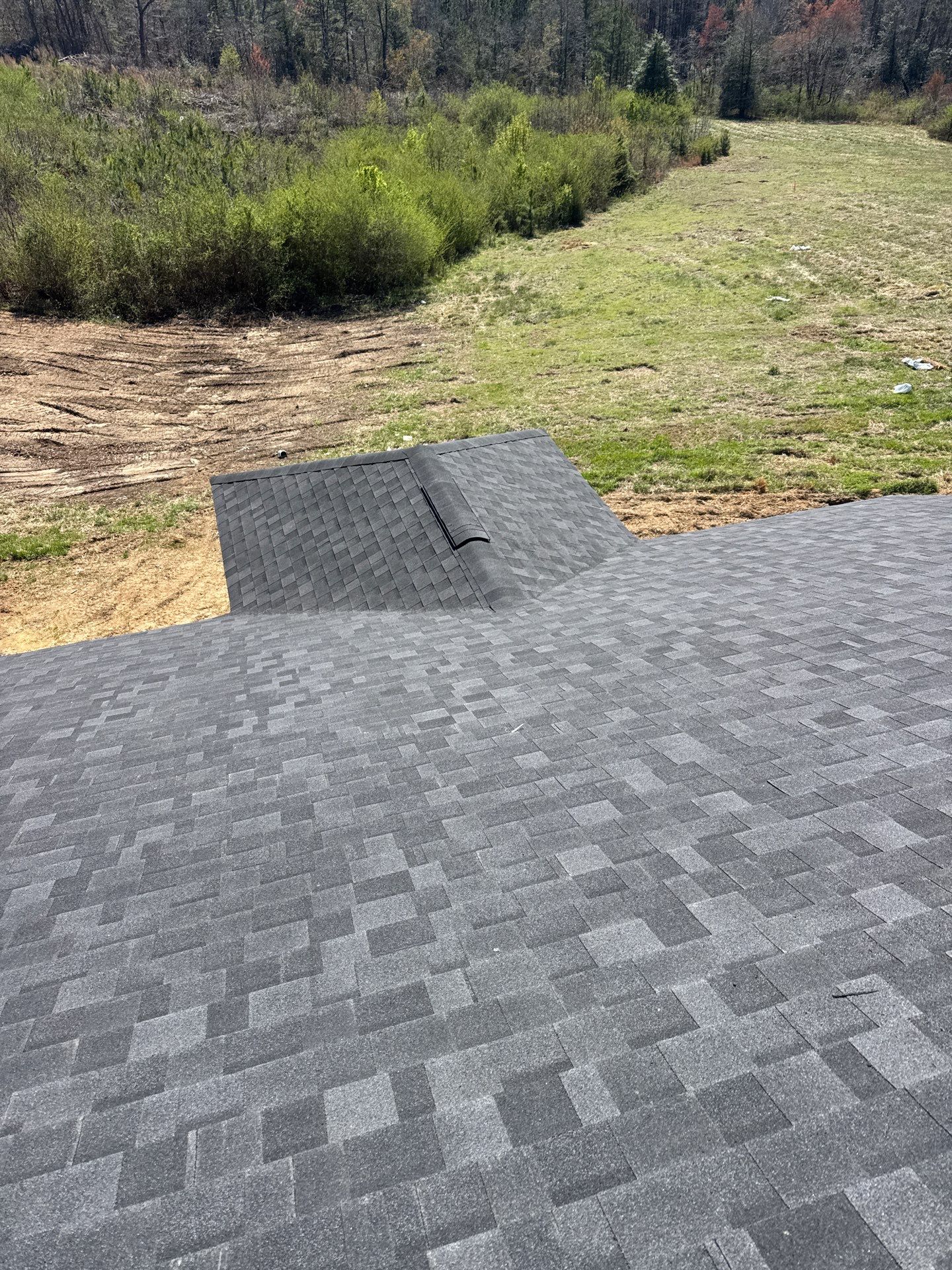 Ridge shingle installation on new construction roof in Broadway NC