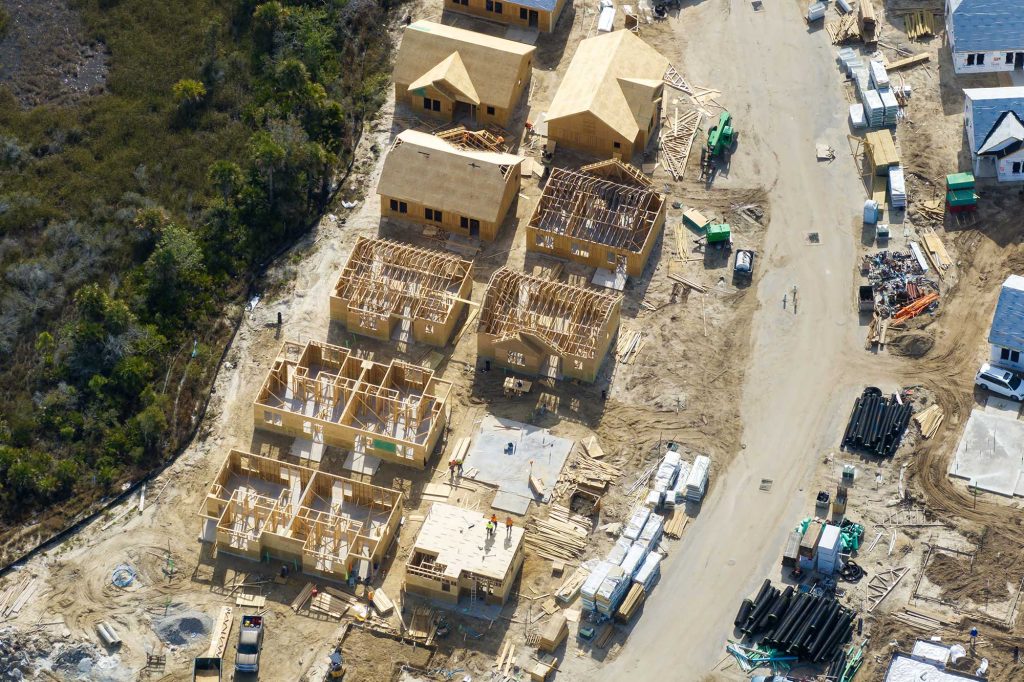 wooden-houses-under-construction-in-new-developing