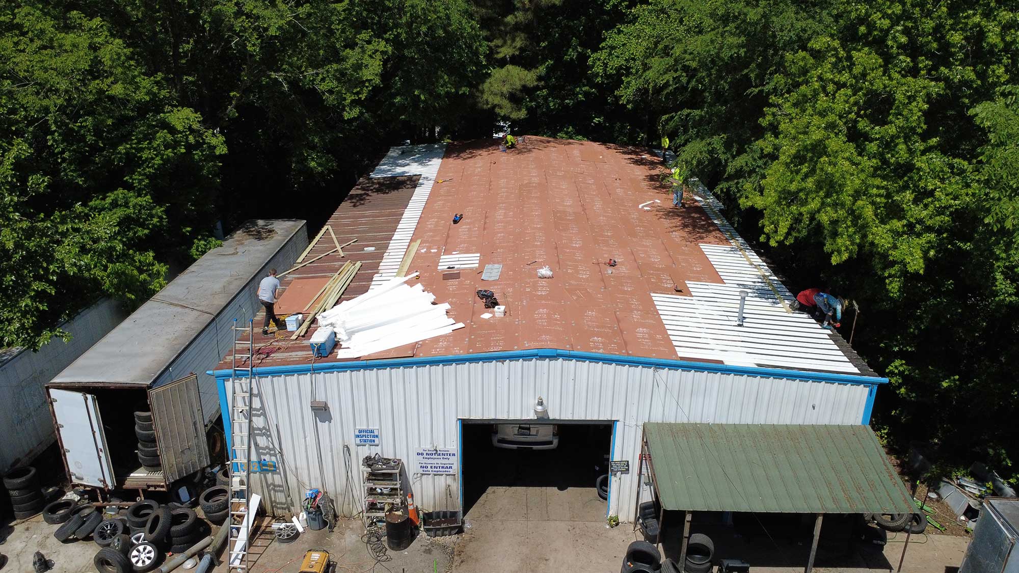 Aerial view of a building showcasing its roof and surrounding area, highlighting architectural features and layout.