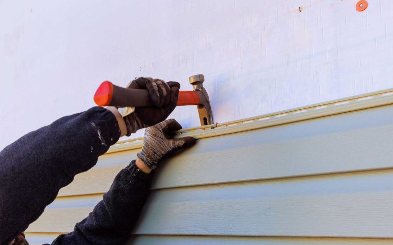 damaged-plastic-siding-of-house-is-replaced