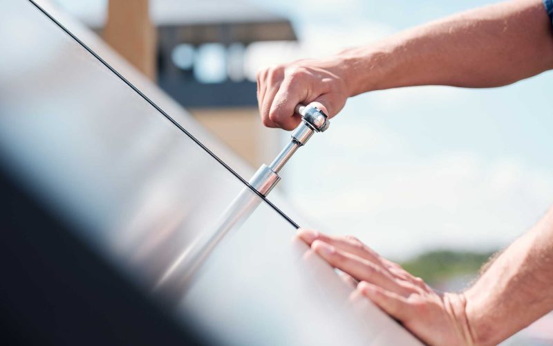 hand-of-technician-master-turning-steel-handle