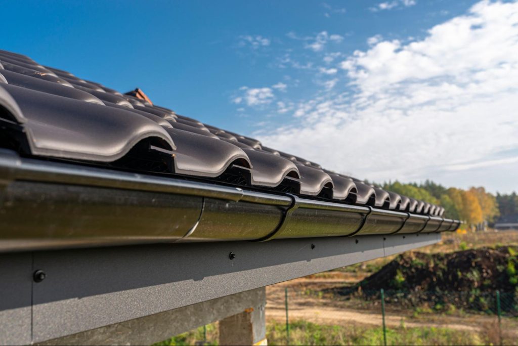Gutter on a shingle roof.